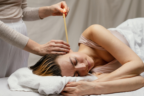 Valtina Health and Wellness Ear Candling Salida Buena Vista Chaffee County Therapist Applying Ear Candling Treatment